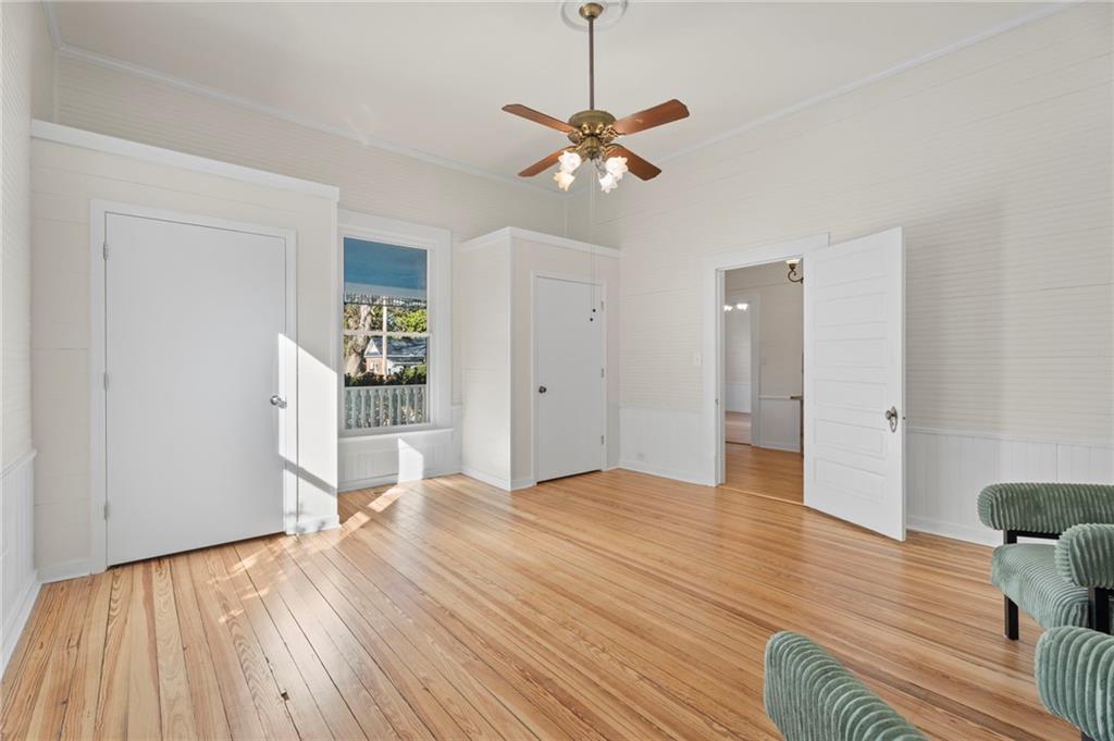 114 Cleveland Street McDonough, GA 30253 - Photo 10 of 71 a view of a livingroom with wooden floor and a ceiling fan