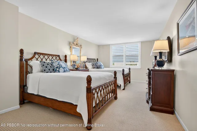 a bedroom with a bed and a night stand