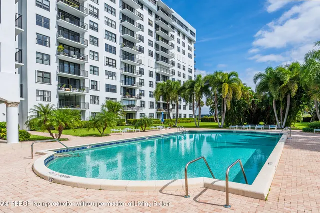 a view of a swimming pool with a patio
