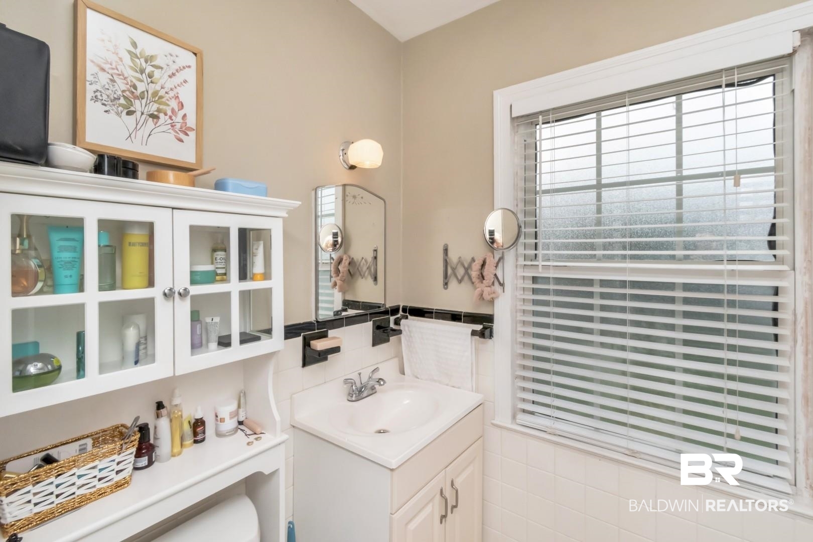 214 Upham Street, Unit 17C Mobile, AL 36607 - Photo 27 of 32 Half bath featuring vanity and tile walls