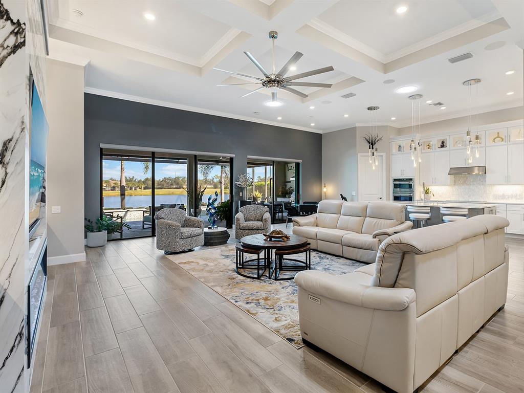 17807 Eastbrook Terrace Lakewood Ranch, FL 34202 - Photo 21 of 92 a living room with furniture and a large window