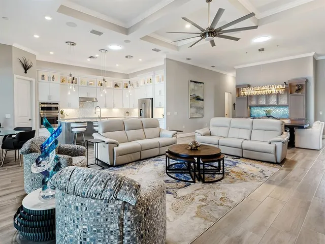 a kitchen with stainless steel appliances white cabinets and a sink