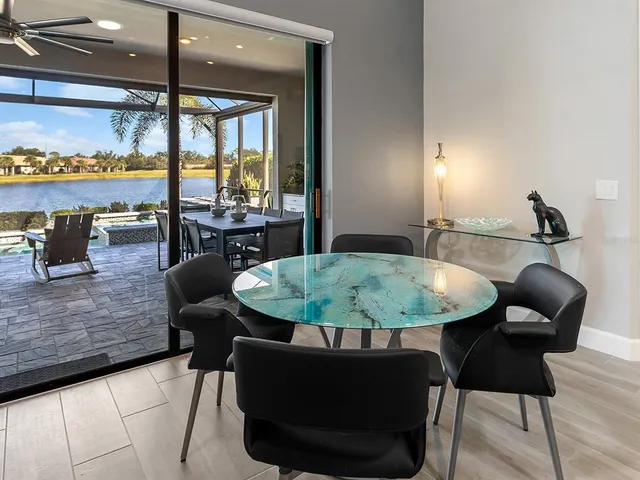 a view of a dining room with furniture window and outside view