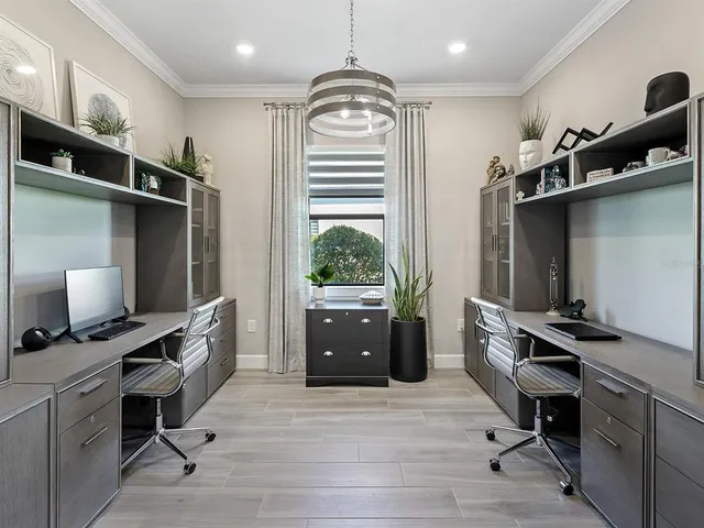a view of swimming pool with a table and chairs