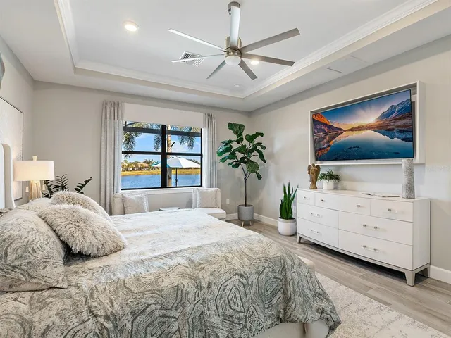 an aerial view of a house with a garden and lake view