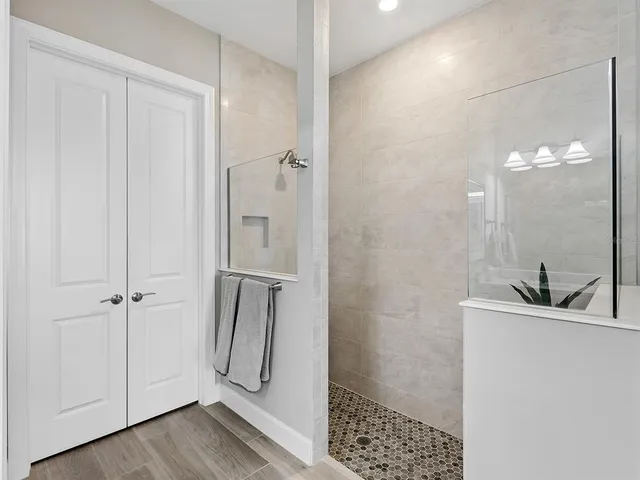 an aerial view of a house with outdoor space and lake view