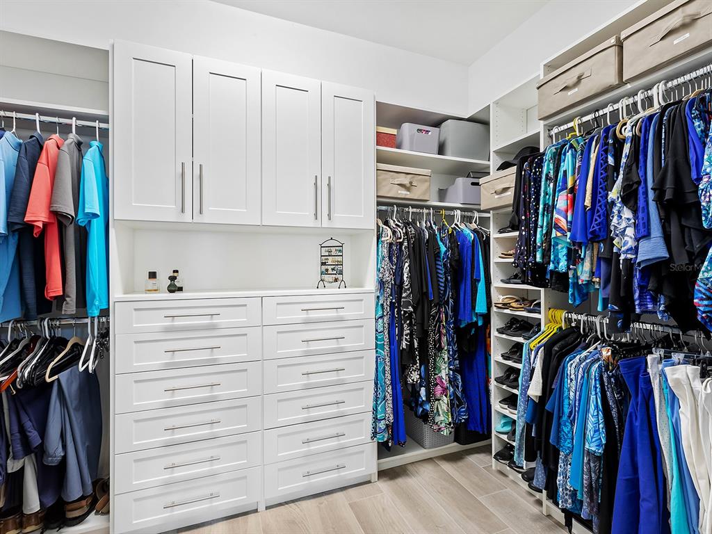 17807 Eastbrook Terrace Lakewood Ranch, FL 34202 - Photo 42 of 92 a view of walk in closet with clothes