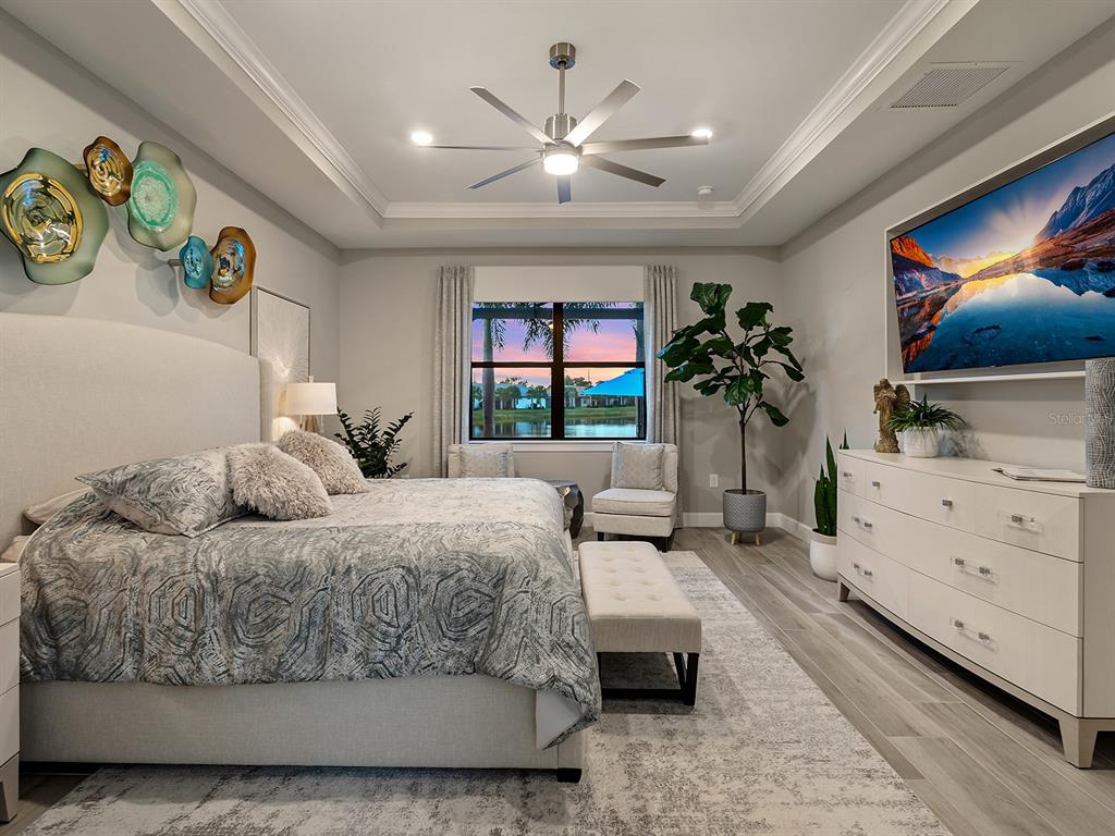 17807 Eastbrook Terrace Lakewood Ranch, FL 34202 - Photo 44 of 92 a living room with furniture and a flat screen tv