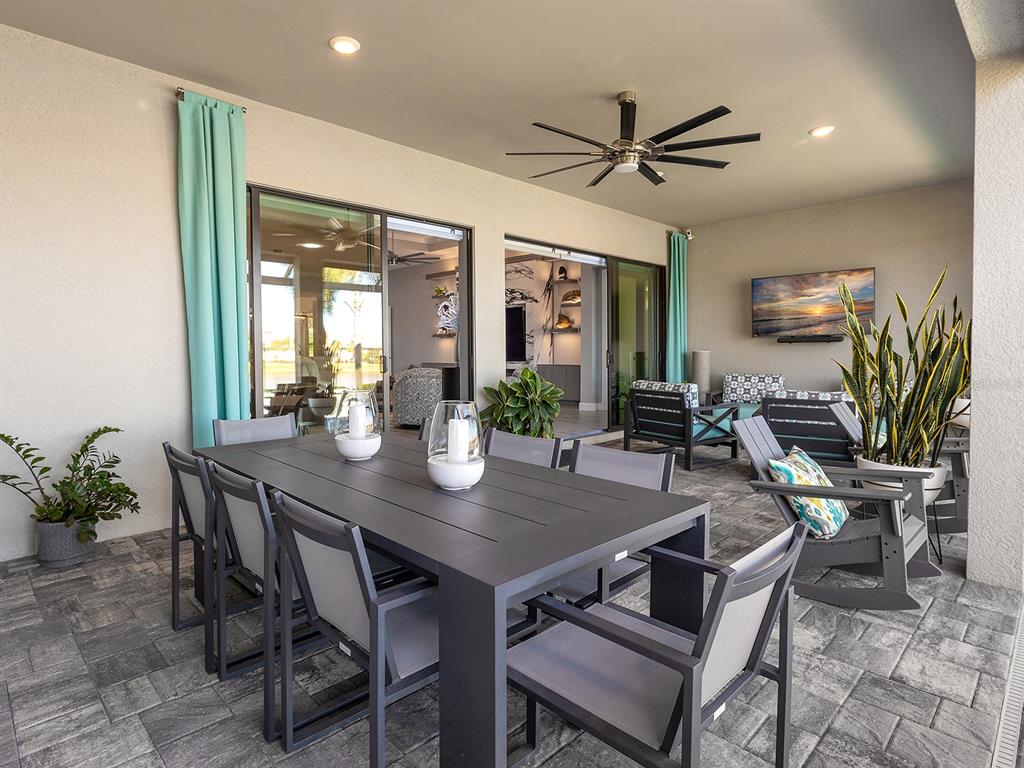 17807 Eastbrook Terrace Lakewood Ranch, FL 34202 - Photo 58 of 92 a view of a dining room with furniture