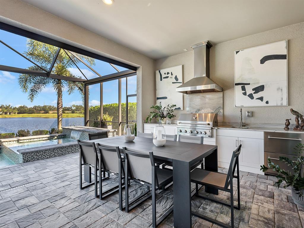 17807 Eastbrook Terrace Lakewood Ranch, FL 34202 - Photo 59 of 92 a view of a dining room with furniture window and outside view