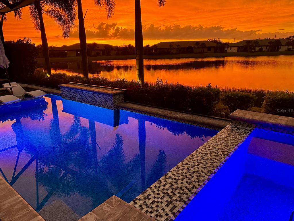 17807 Eastbrook Terrace Lakewood Ranch, FL 34202 - Photo 67 of 92 a view of swimming pool with a table and chairs
