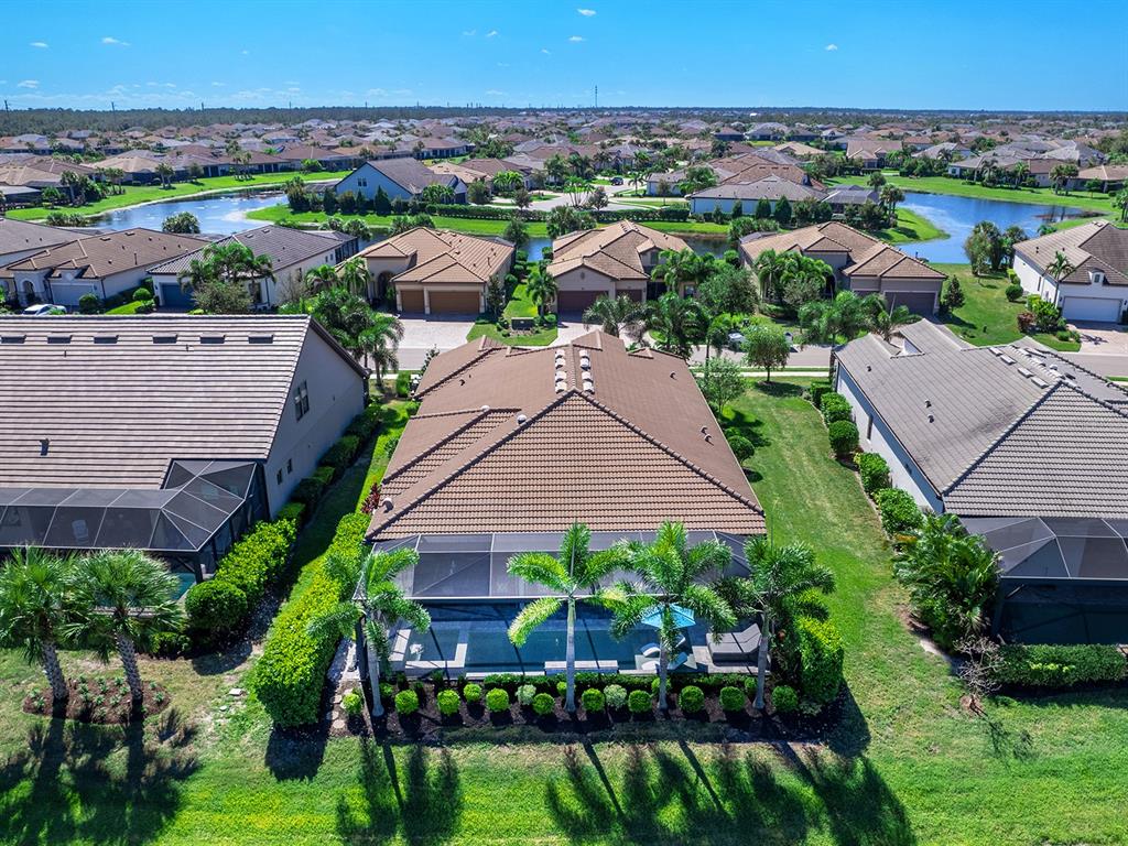 17807 Eastbrook Terrace Lakewood Ranch, FL 34202 - Photo 68 of 92 an aerial view of a house with a garden