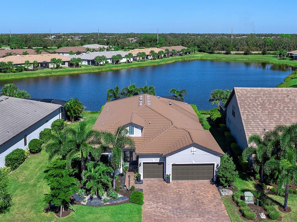 17807 Eastbrook Terrace Lakewood Ranch, FL 34202 - Photo 74 of 92 an aerial view of a house with outdoor space and lake view