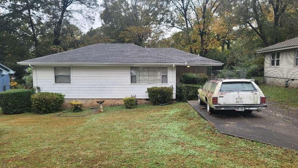 1990 Meadow Lane Decatur, GA 30032 - Photo 1 of 1 a car parked in front of a house