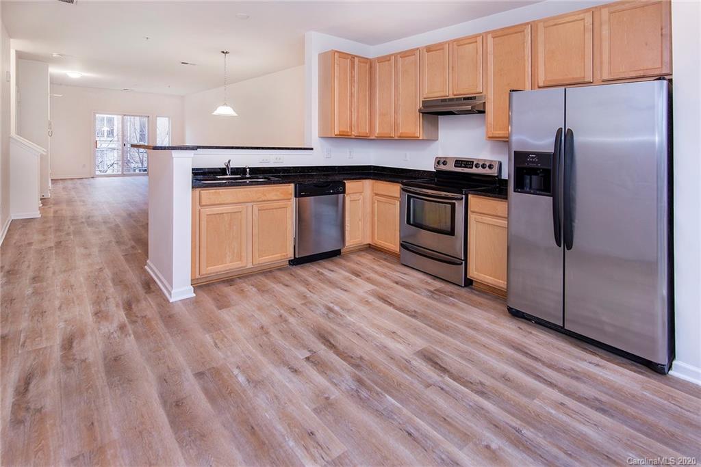 618 Raphael Place Charlotte, NC 28205 - Photo 8 of 15 a kitchen with stainless steel appliances granite countertop a refrigerator and a stove top oven