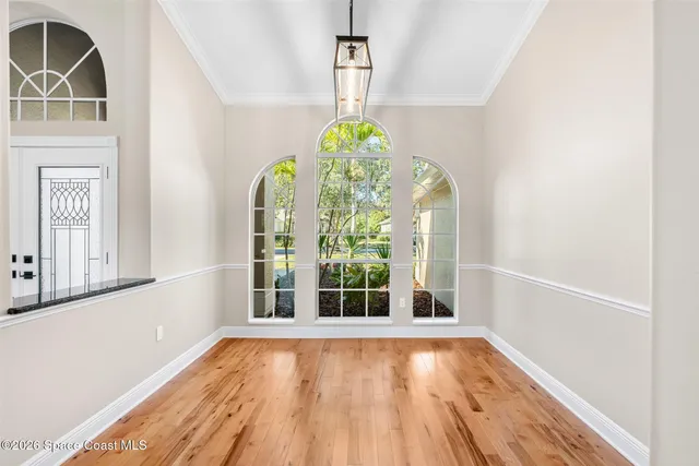 a living room with furniture fireplace and a large window