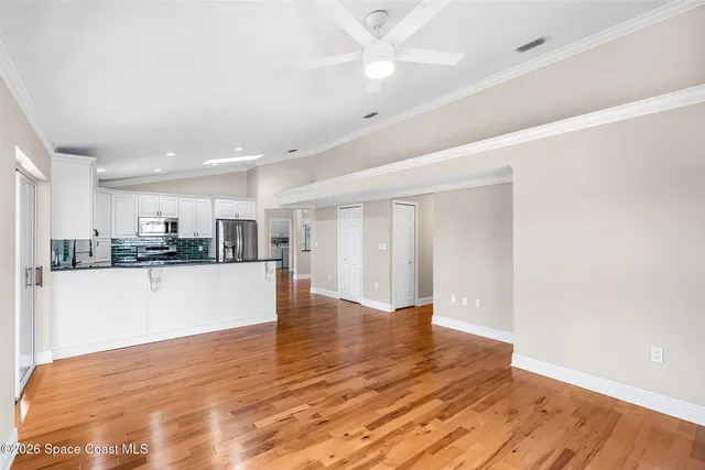a bathroom with a granite countertop tub a double vanity sink and a mirror