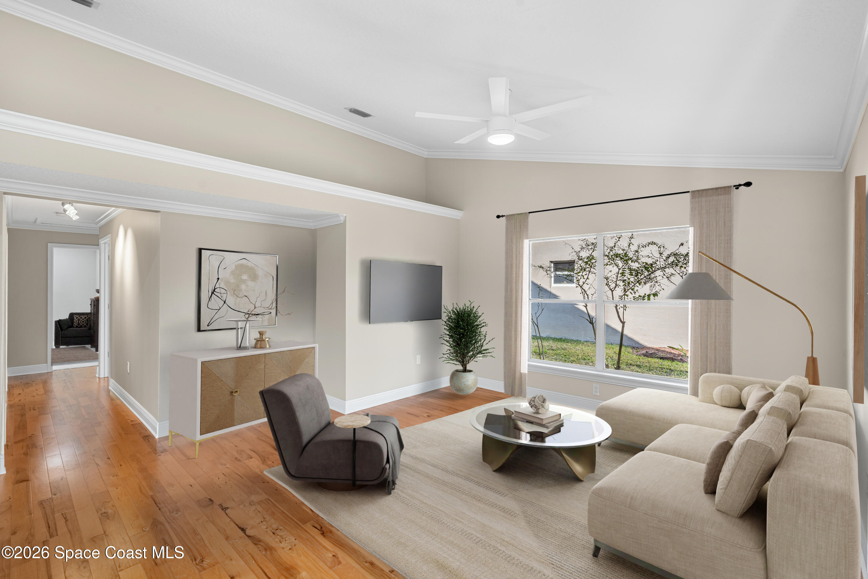 8033 Kingswood Way Melbourne, FL 32940 - Photo 29 of 70 a living room with furniture and a large window