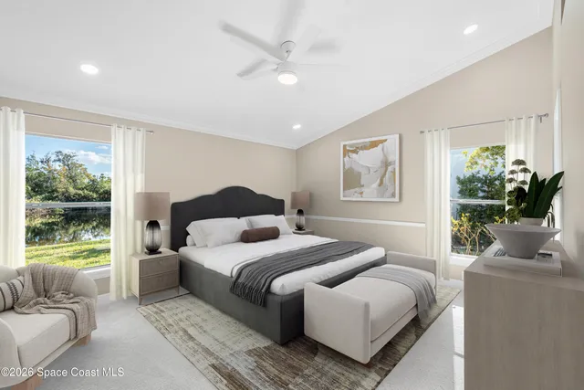 a bedroom with a bed and a couch