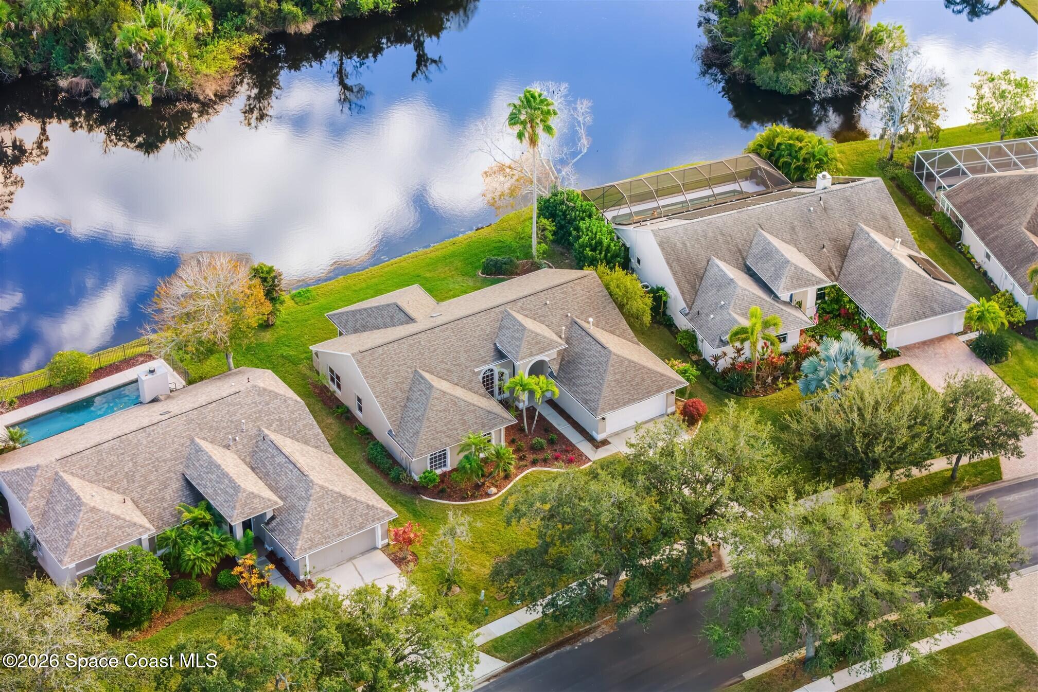 8033 Kingswood Way Melbourne, FL 32940 - Photo 4 of 70 an aerial view of a house with a yard