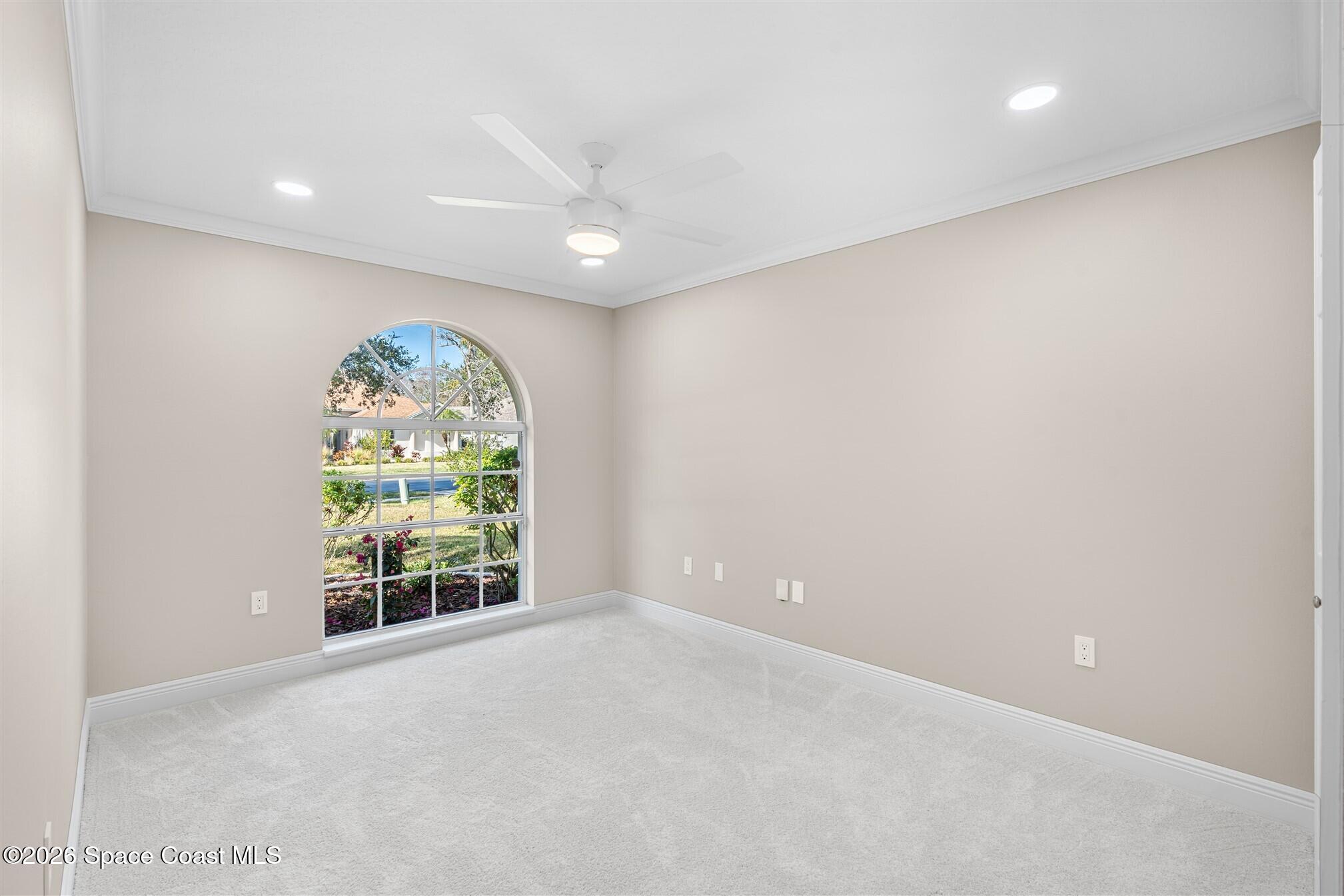 8033 Kingswood Way Melbourne, FL 32940 - Photo 45 of 70 an empty room with windows and tree