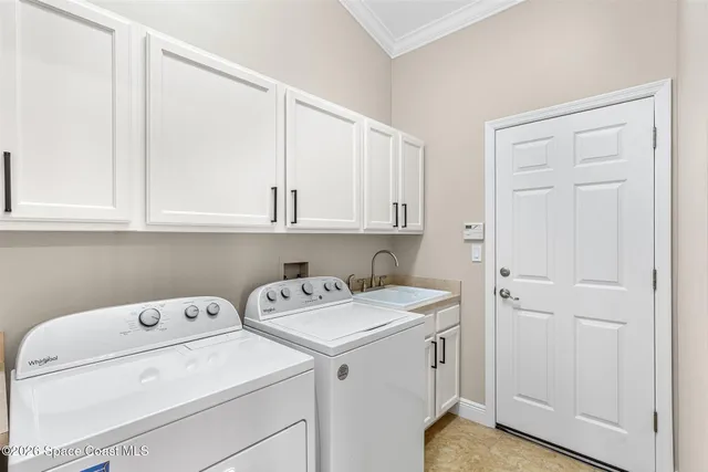 an aerial view of residential houses with outdoor space and swimming pool