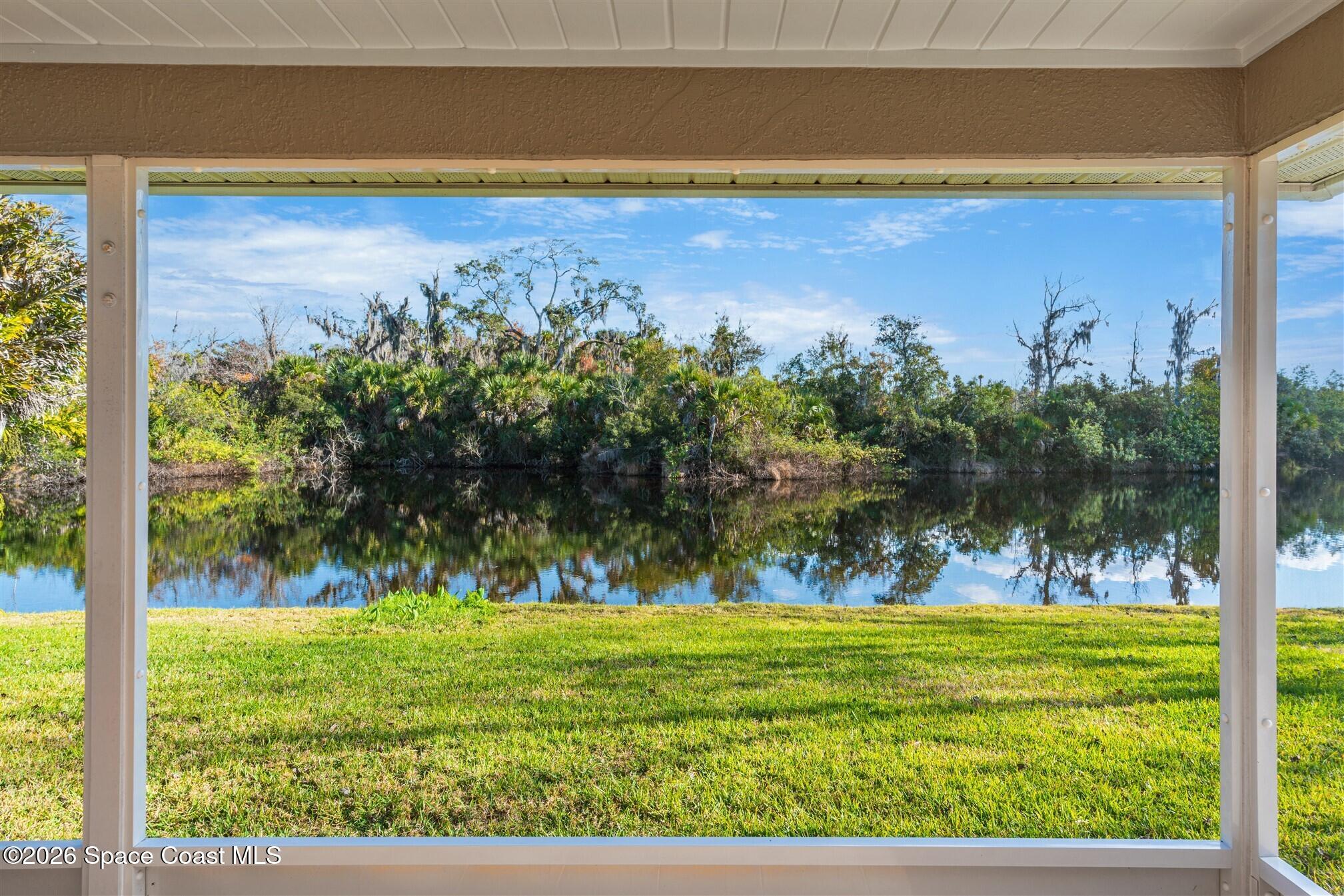 8033 Kingswood Way Melbourne, FL 32940 - Photo 49 of 70 a view of a swimming pool with an outdoor space and seating area