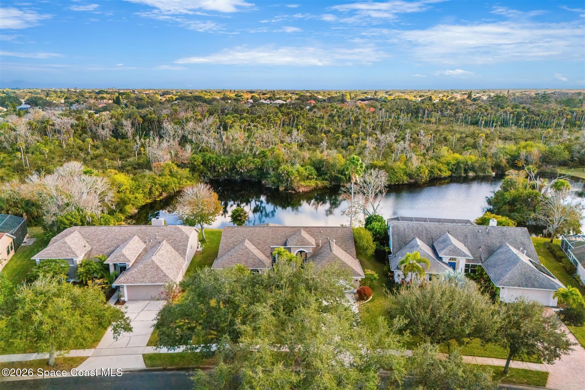 8033 Kingswood Way Melbourne, FL 32940 - Photo 50 of 70 an aerial view of a house with a yard