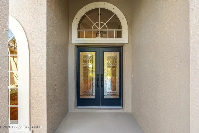 a front view of a house with a white door