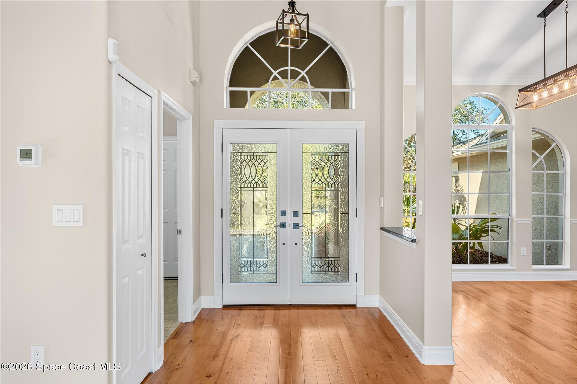 8033 Kingswood Way Melbourne, FL 32940 - Photo 6 of 70 a view of an entryway with wooden floor