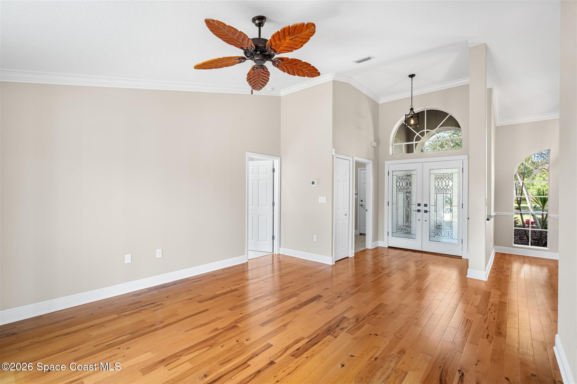 8033 Kingswood Way Melbourne, FL 32940 - Photo 8 of 70 a view of an entryway with wooden floor