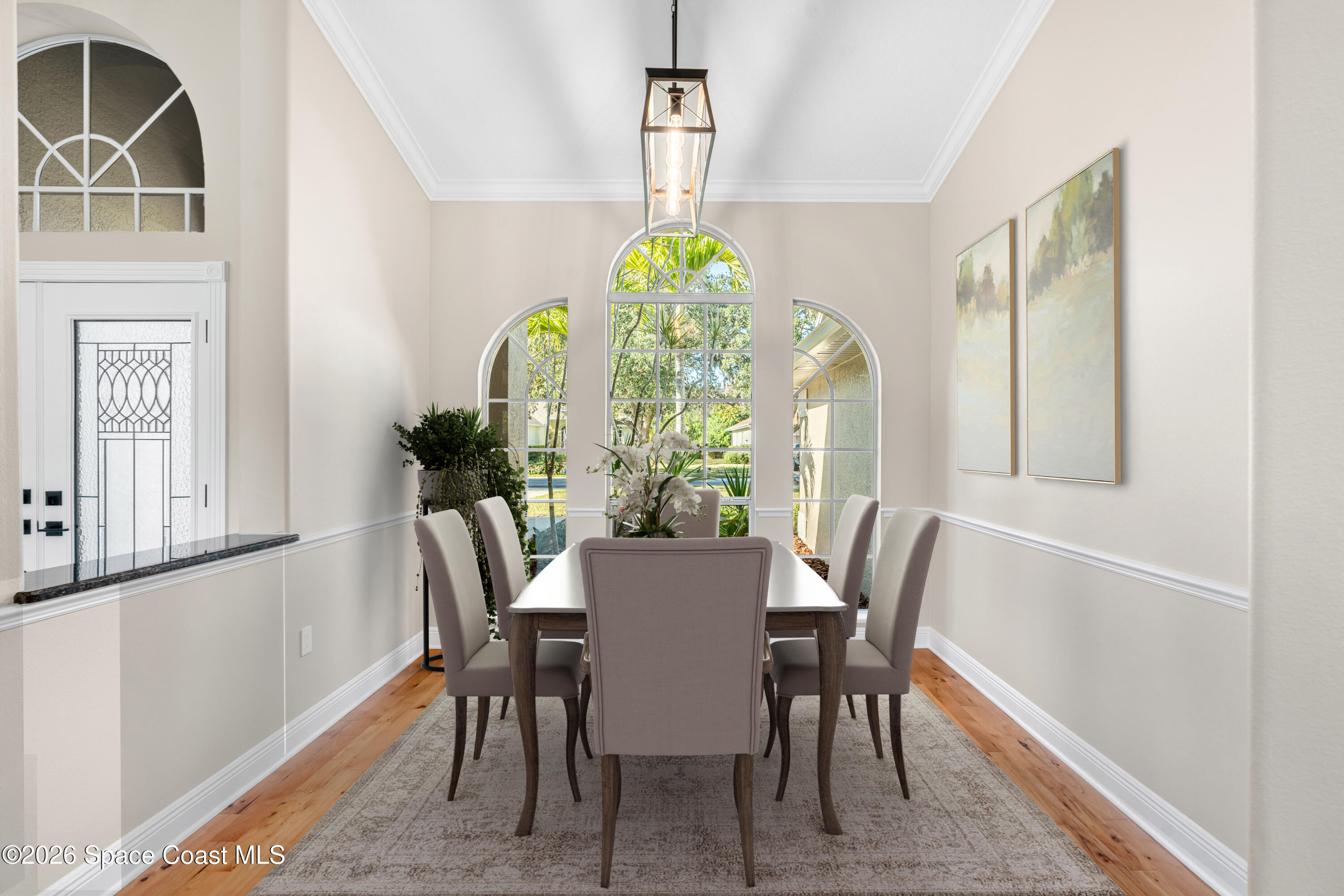 8033 Kingswood Way Melbourne, FL 32940 - Photo 10 of 70 a view of a dining room with furniture window and wooden floor
