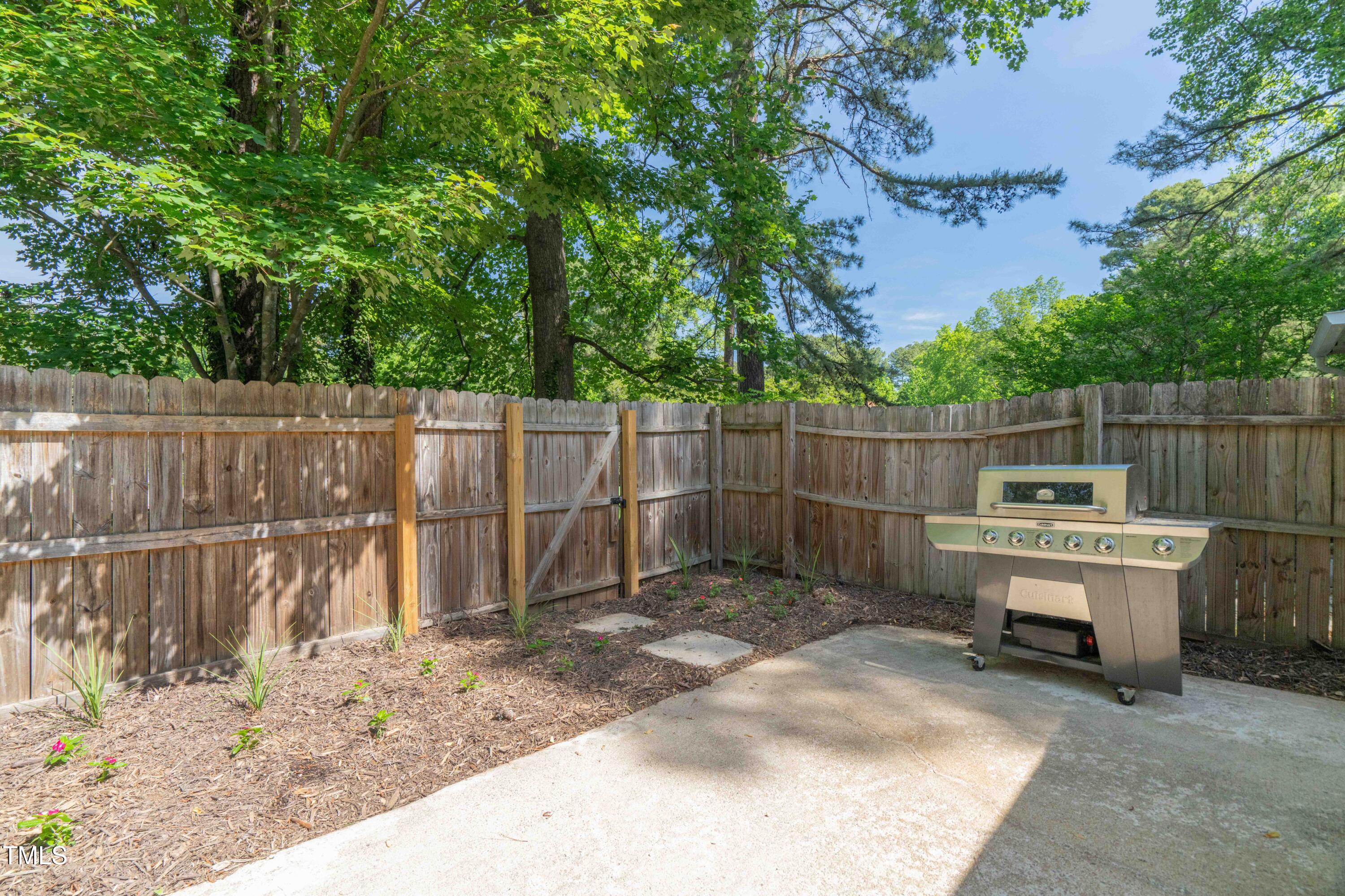 1316 Garden Crest Circle Raleigh, NC 27609 - Photo 13 of 46 a view of a wooden fence