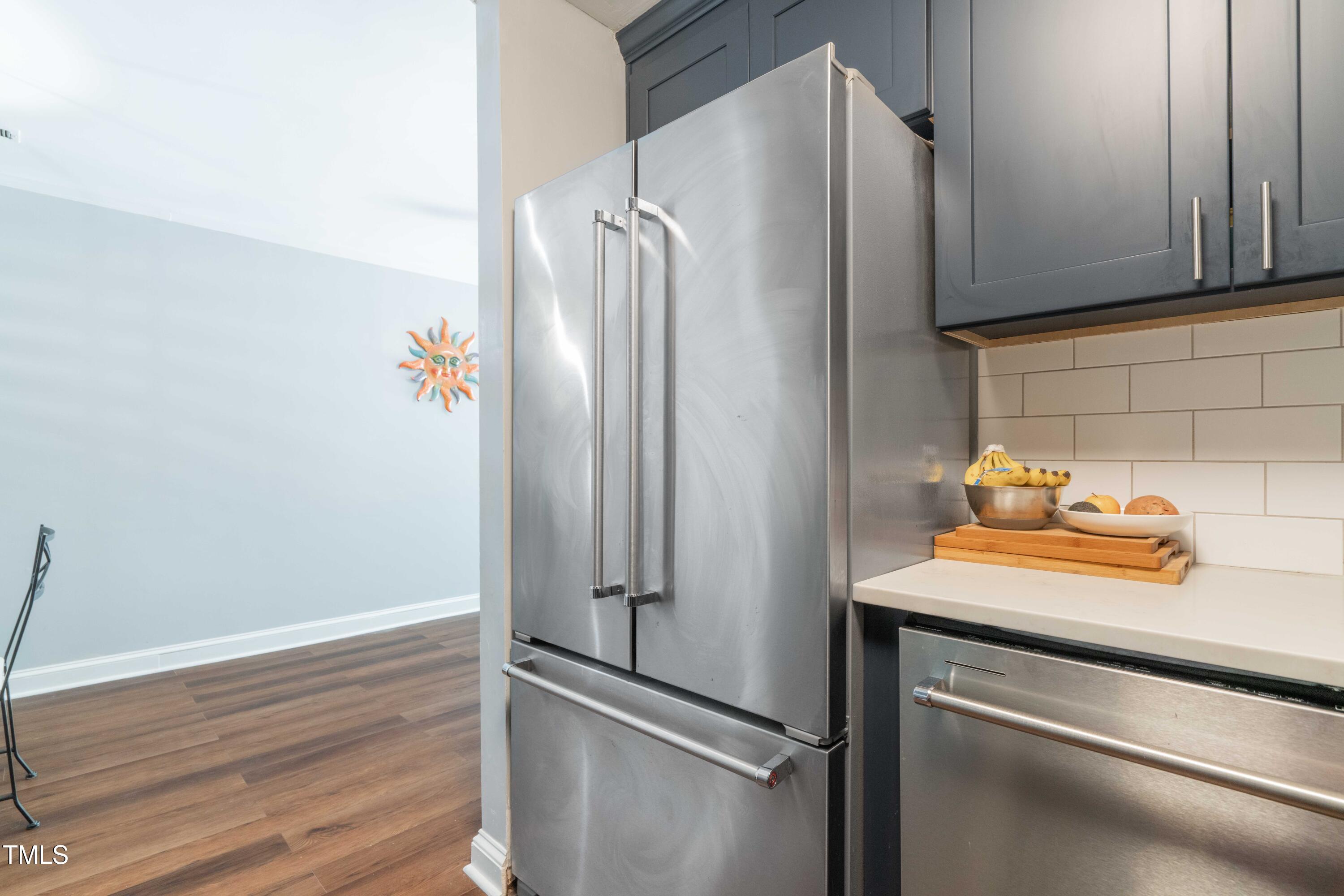 1316 Garden Crest Circle Raleigh, NC 27609 - Photo 20 of 46 a kitchen with metallic refrigerator and cabinets