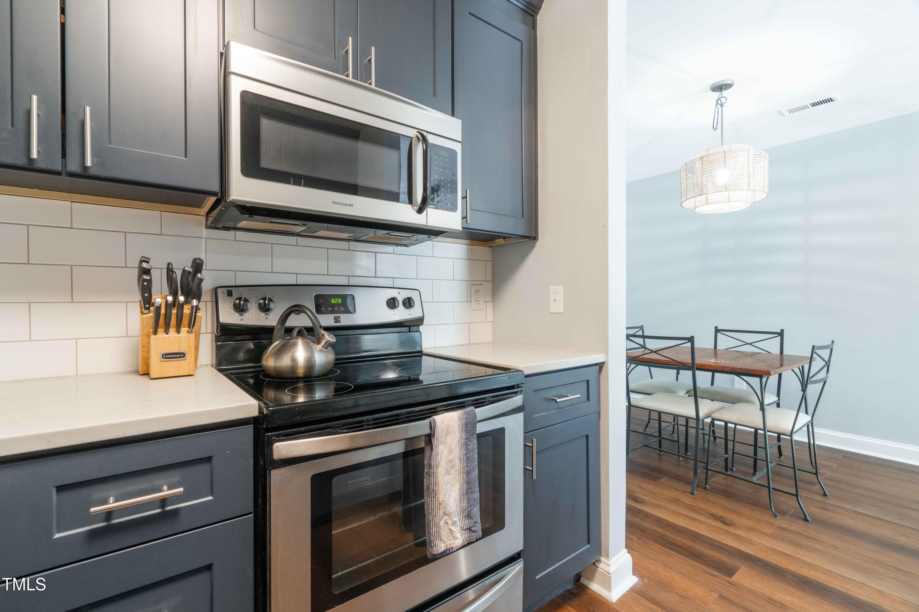 1316 Garden Crest Circle Raleigh, NC 27609 - Photo 21 of 46 a kitchen with a stove and a microwave