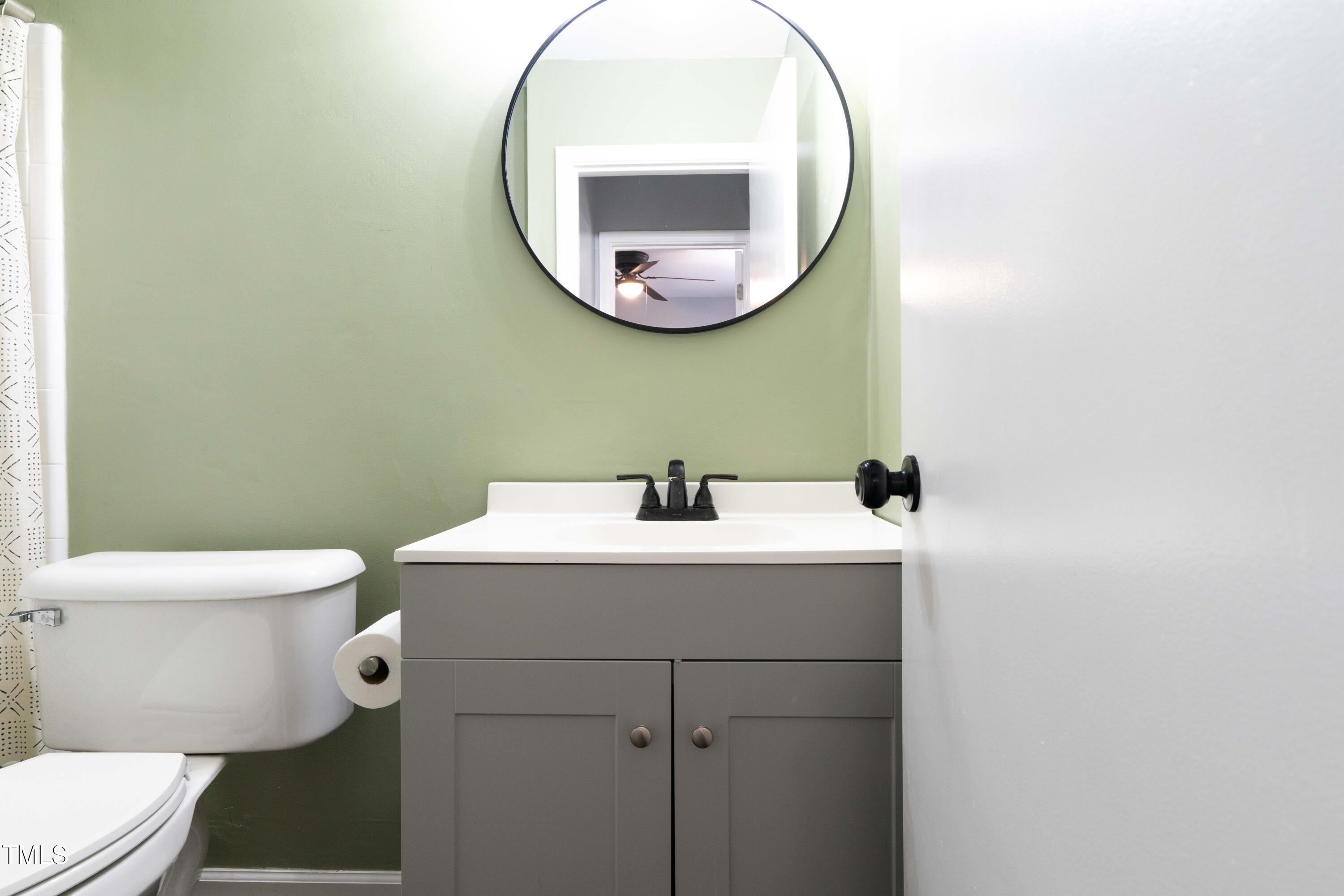 1316 Garden Crest Circle Raleigh, NC 27609 - Photo 25 of 46 a bathroom with a sink and a mirror