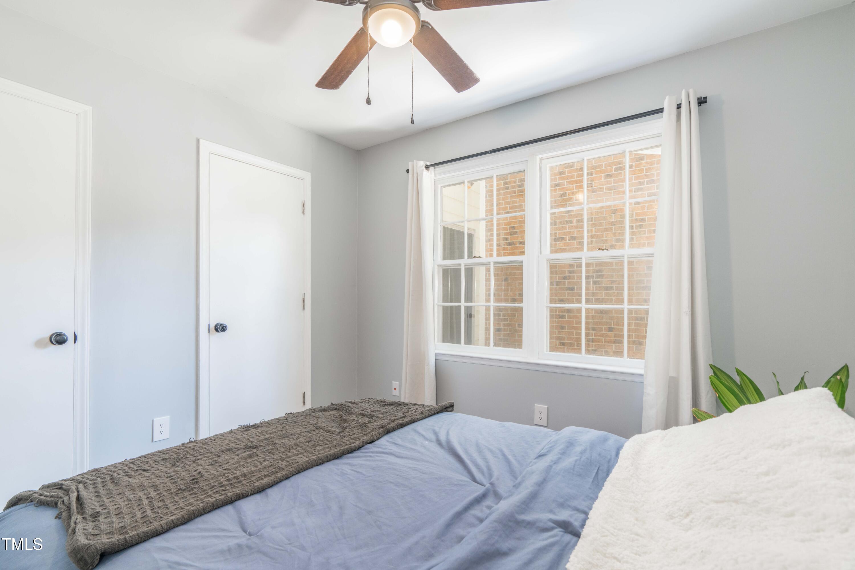 1316 Garden Crest Circle Raleigh, NC 27609 - Photo 28 of 46 a bedroom with a bed and a window