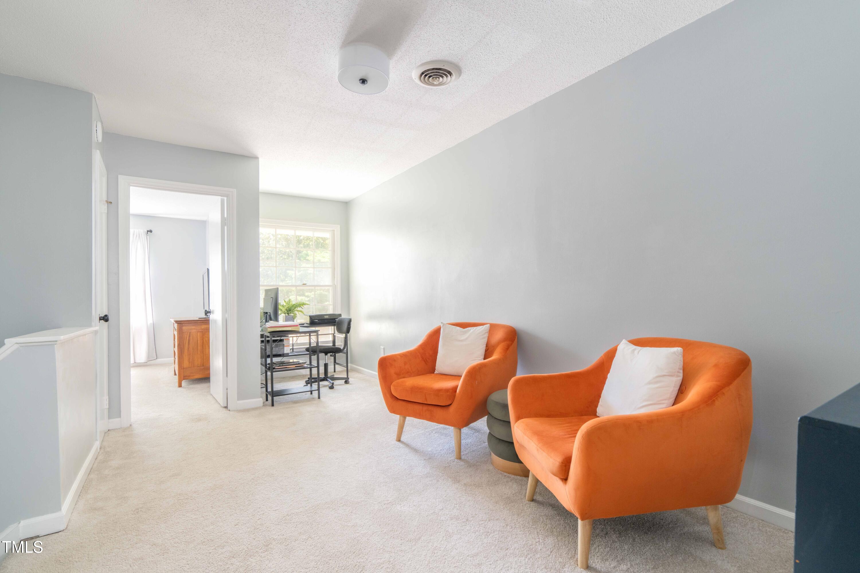 1316 Garden Crest Circle Raleigh, NC 27609 - Photo 29 of 46 a living room with furniture and a couch