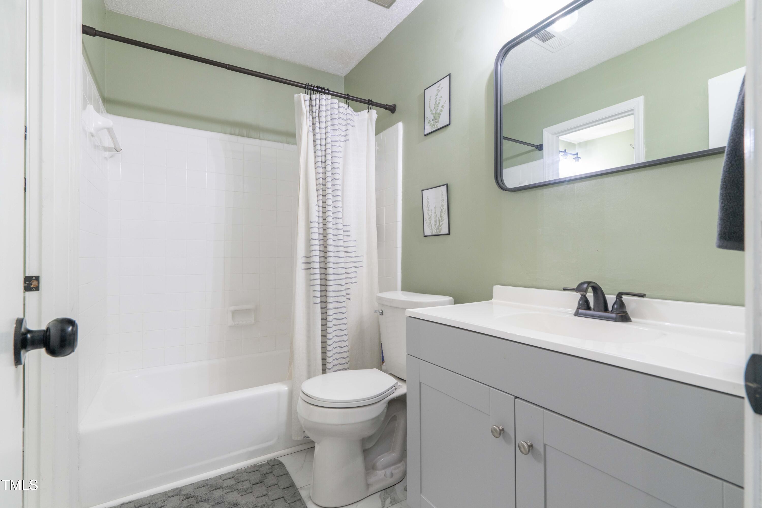 1316 Garden Crest Circle Raleigh, NC 27609 - Photo 36 of 46 a bathroom with a sink a toilet and shower