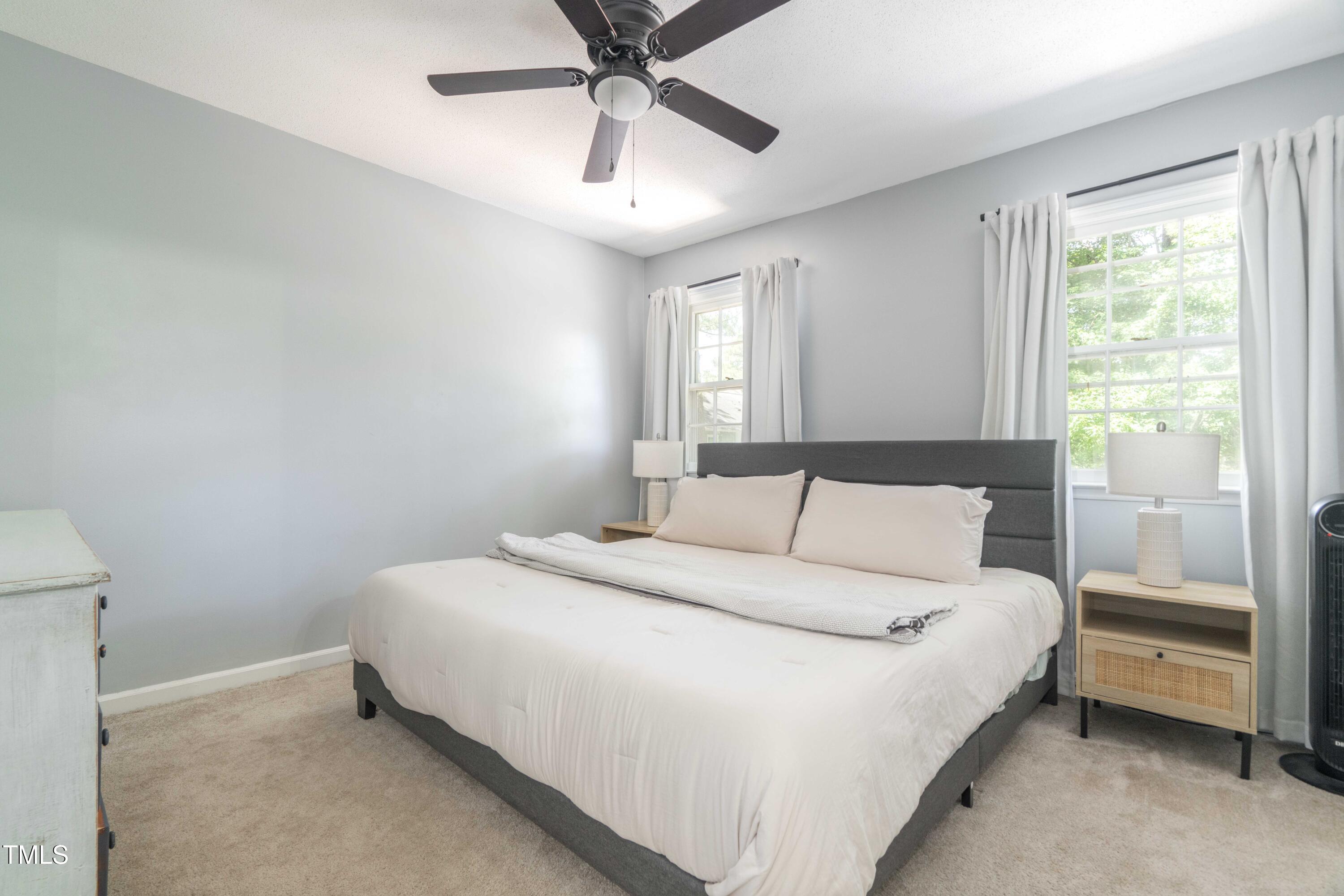 1316 Garden Crest Circle Raleigh, NC 27609 - Photo 42 of 46 a bedroom with a bed and a window