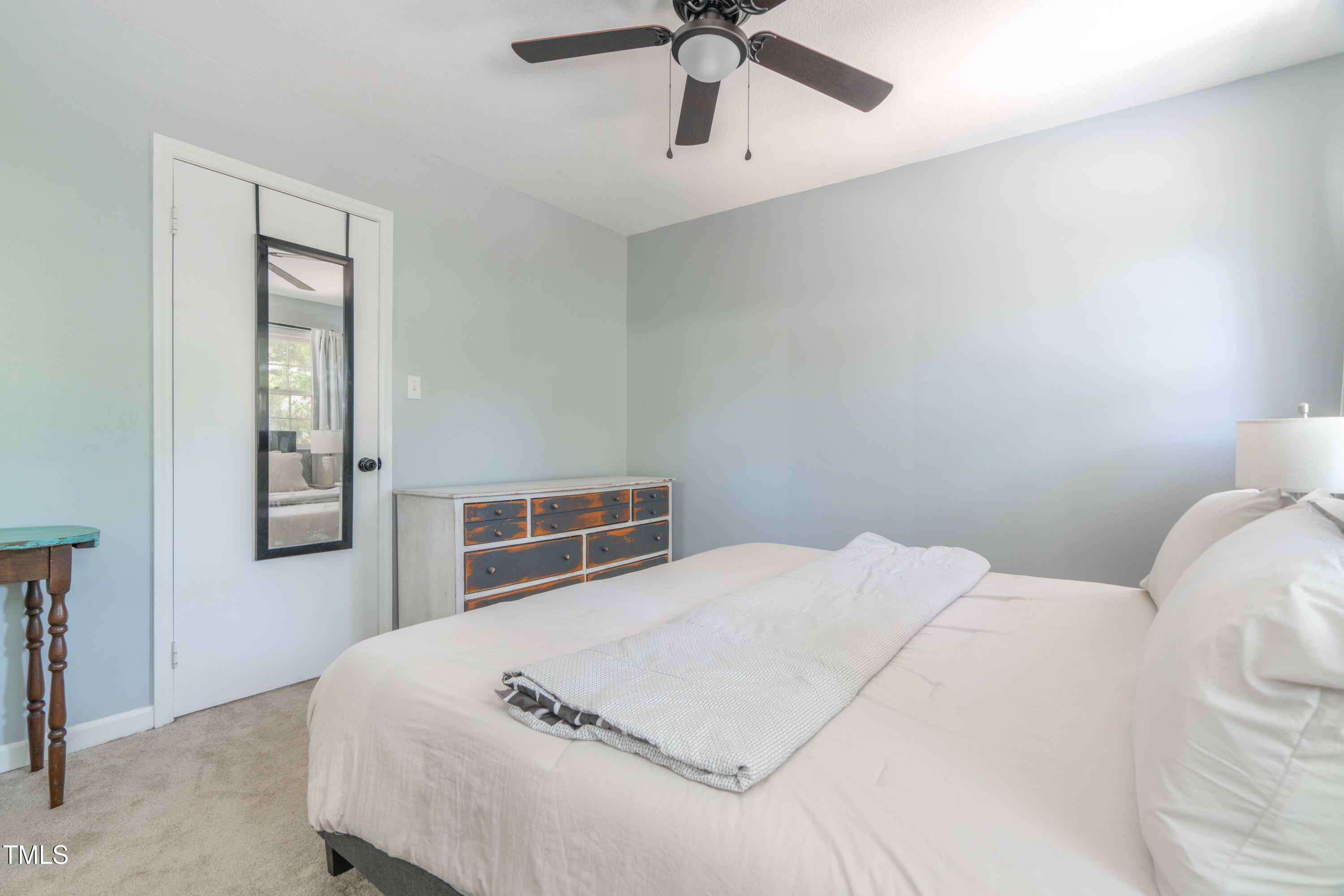 1316 Garden Crest Circle Raleigh, NC 27609 - Photo 43 of 46 a bedroom with a bed and window