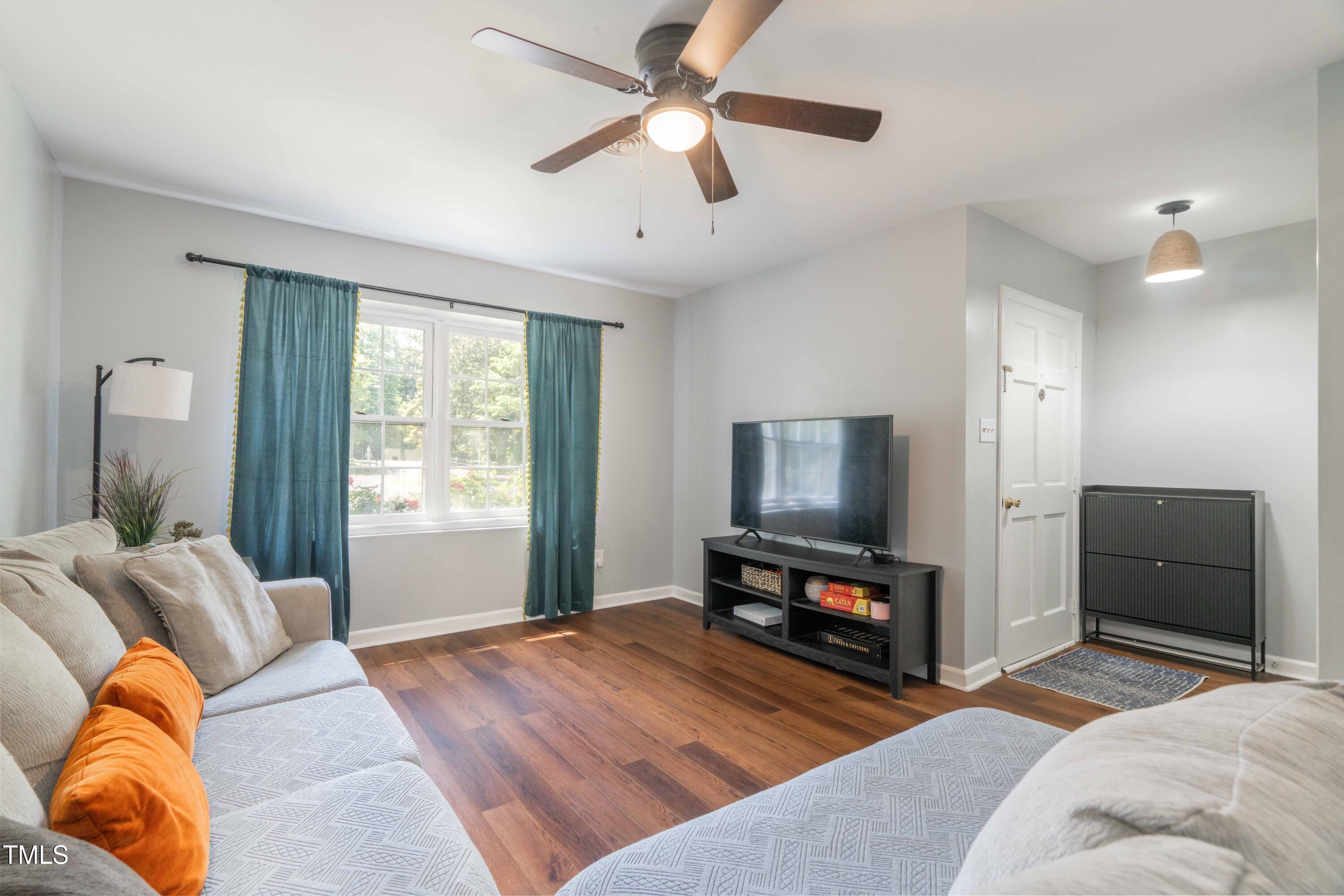 1316 Garden Crest Circle Raleigh, NC 27609 - Photo 5 of 46 a bedroom with furniture and a flat screen tv