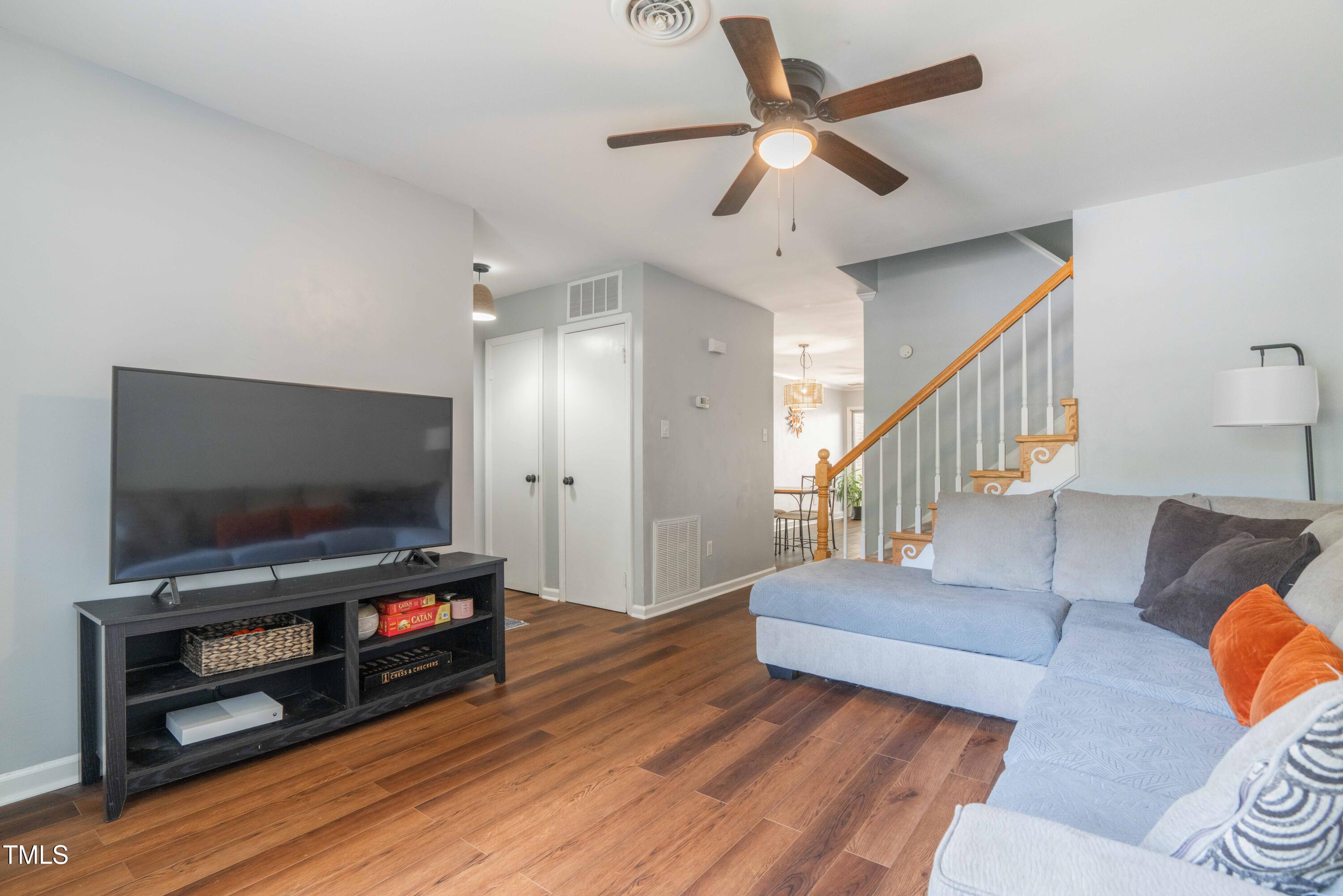 1316 Garden Crest Circle Raleigh, NC 27609 - Photo 6 of 46 a living room with furniture and a flat screen tv