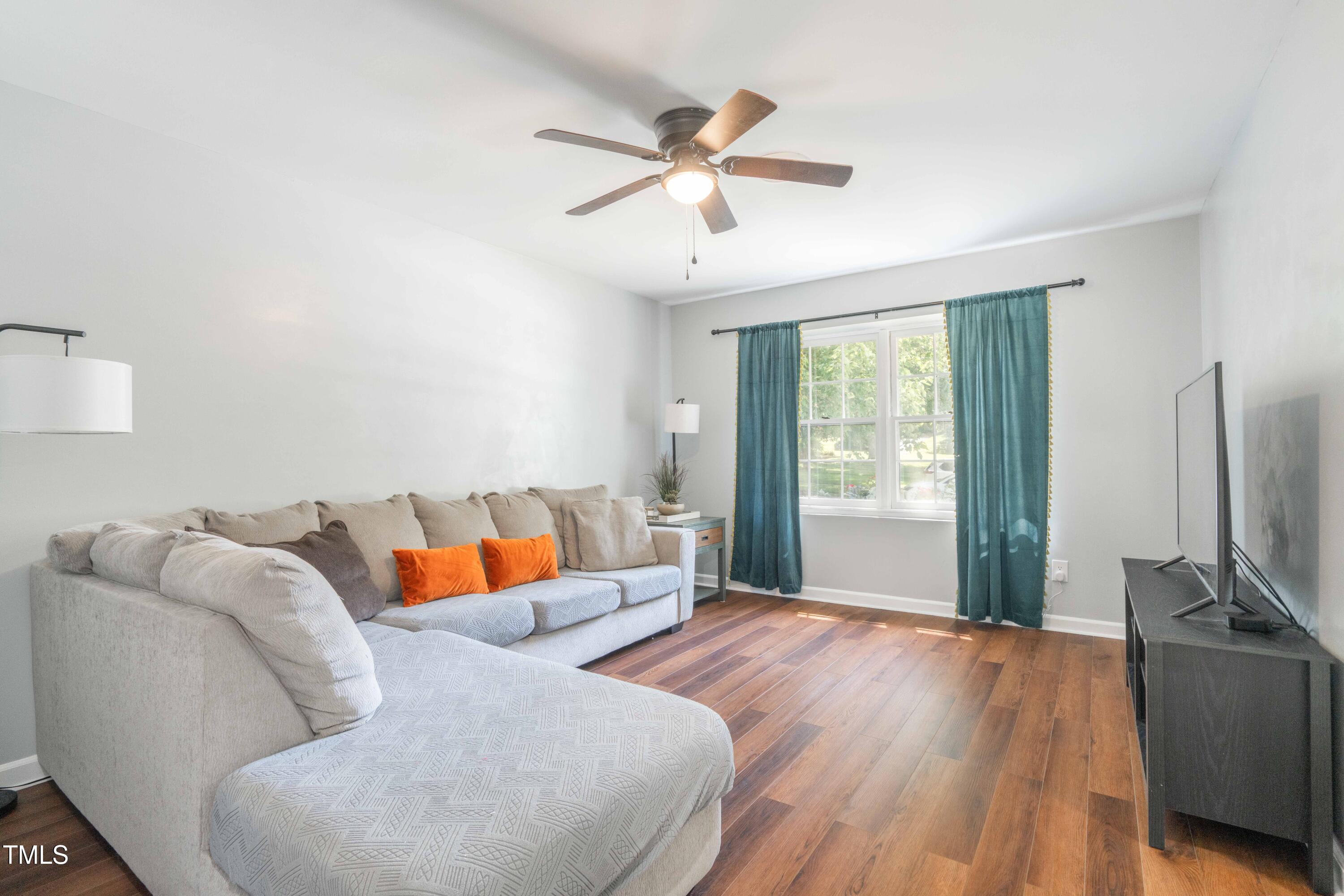 1316 Garden Crest Circle Raleigh, NC 27609 - Photo 7 of 46 a bedroom with furniture and a flat screen tv