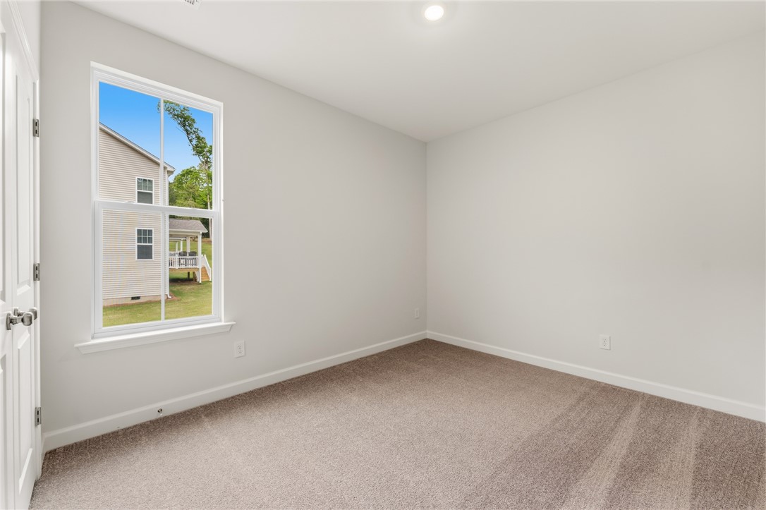 110 Lakeside Drive Anderson, SC 29621 - Photo 28 of 34 This bright bedroom offers a neutral canvas and comfortable carpet, perfect for personalizing your private space.