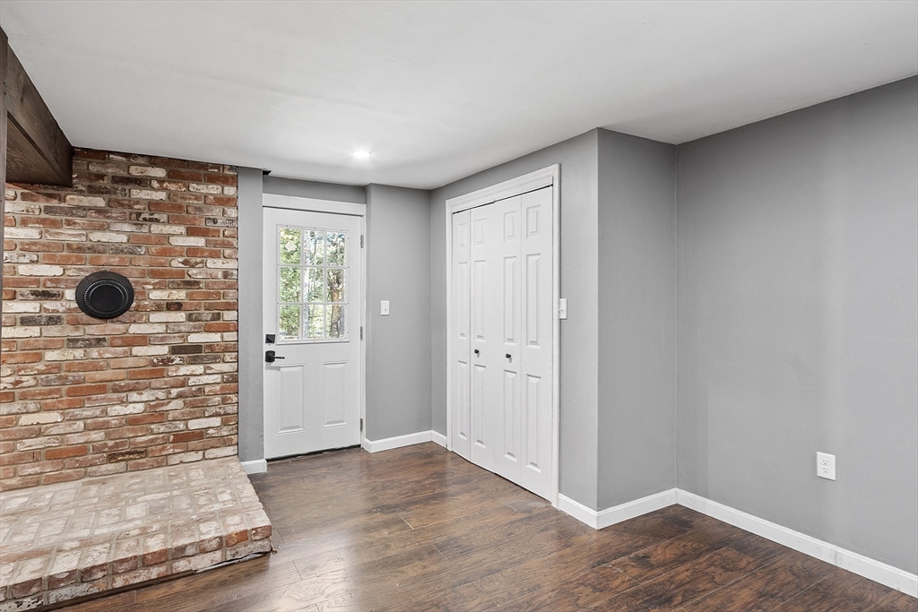 8 Country Road Lunenburg, MA 01462 - Photo 33 of 42 an empty room with wooden floor and windows