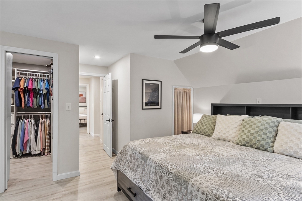 8 Country Road Lunenburg, MA 01462 - Photo 7 of 42 a bedroom with a large bed and a ceiling fan