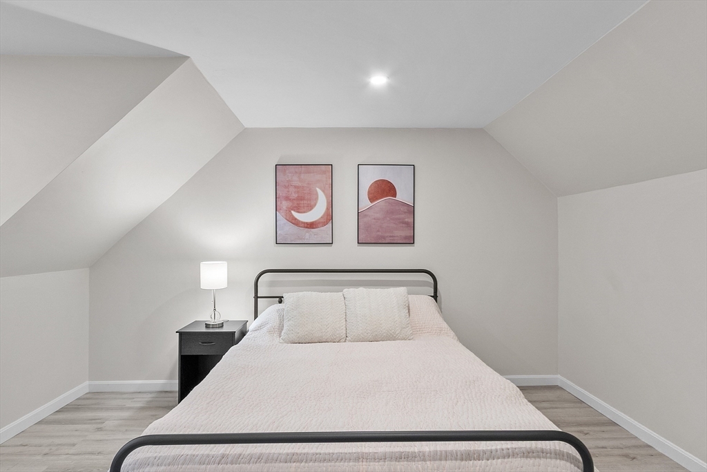 8 Country Road Lunenburg, MA 01462 - Photo 9 of 42 a bedroom with a bed and painting on the wall