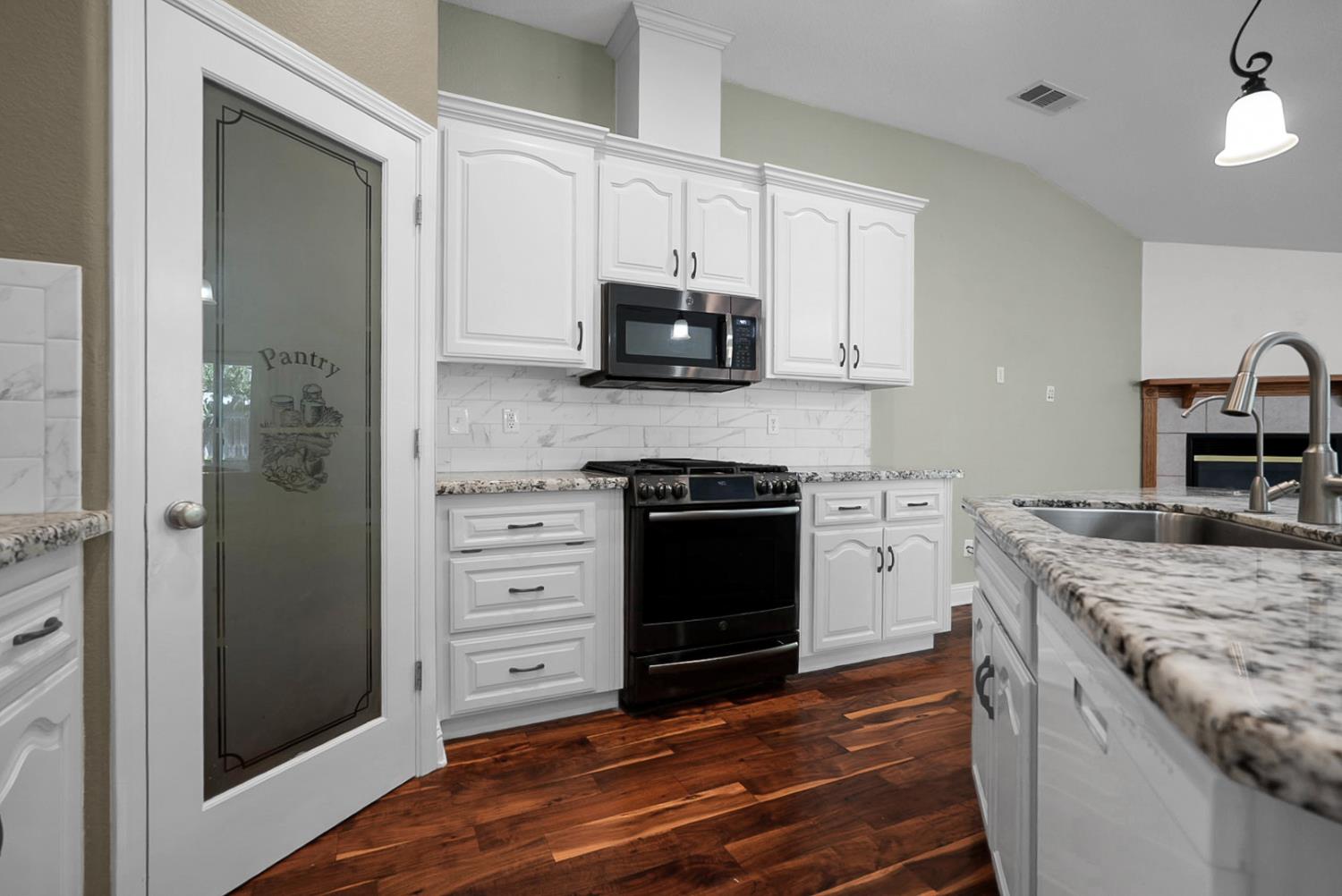 1163 Bailey Drive Ripon, CA 95366 - Photo 7 of 37 Kitchen featuring generous counter space.