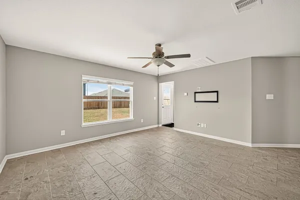 a view of an empty room with a window